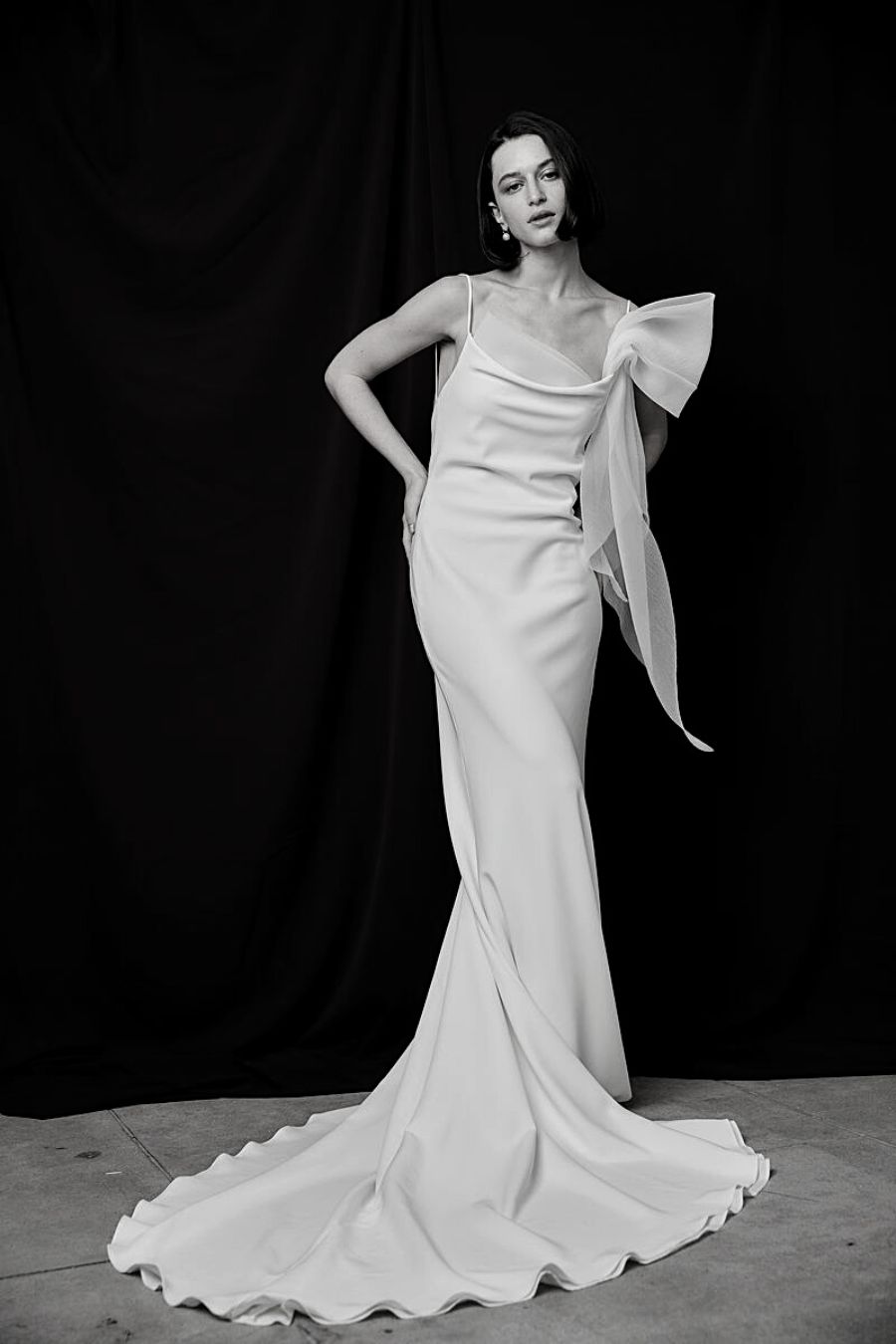 model standing in crepe slip dress