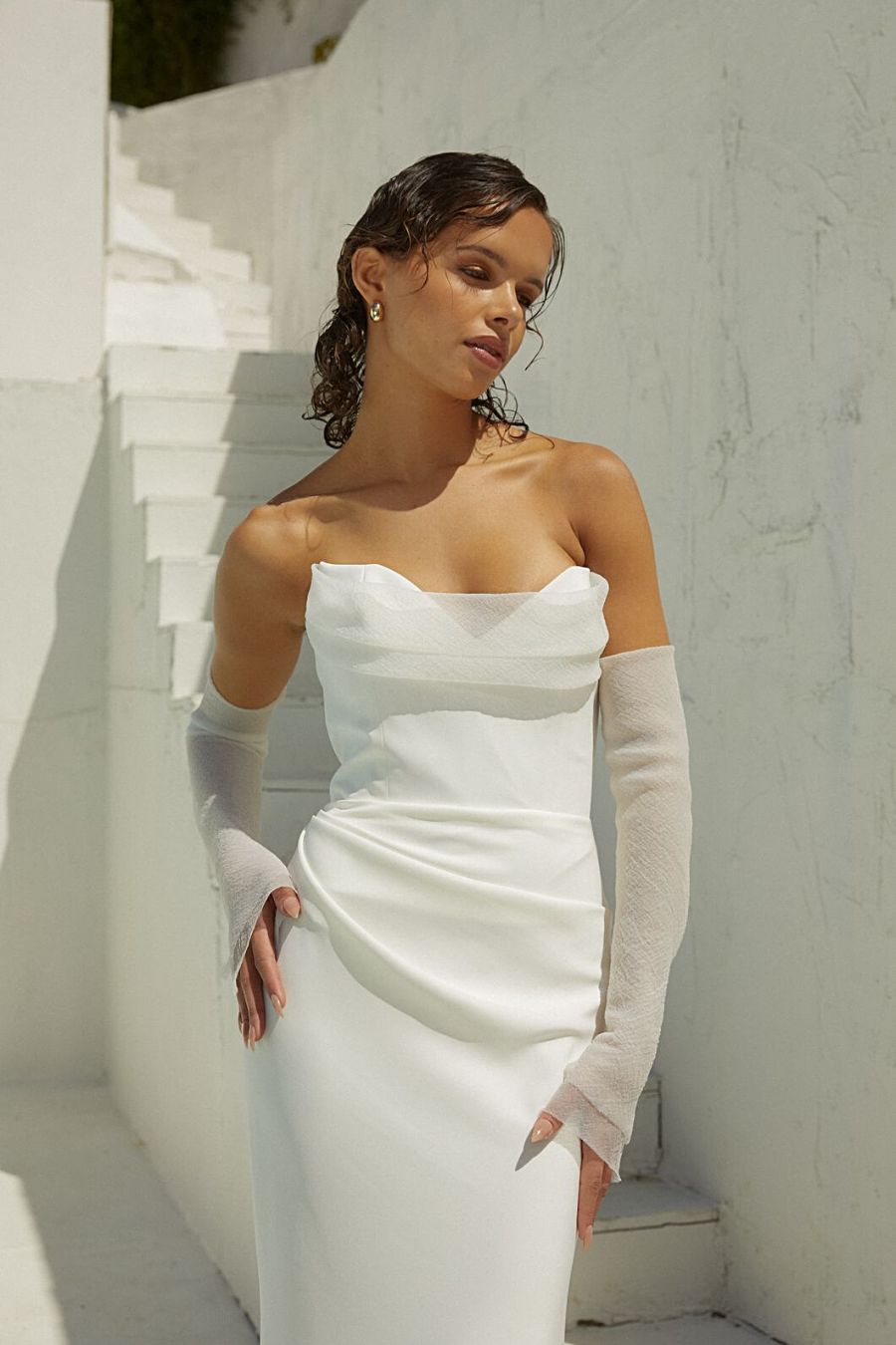 Strapless white minimal wedding dress with detachable sleeves