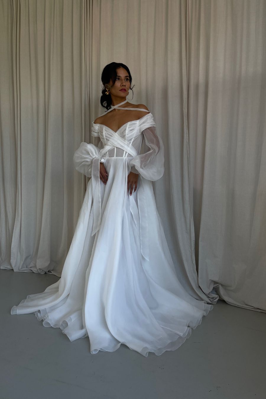 bride in silk aline wedding dress with off shoulder long sleeves